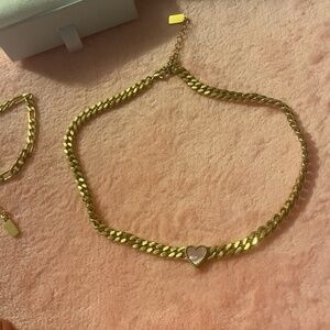 Neckace 14 carat gold . And braclet.